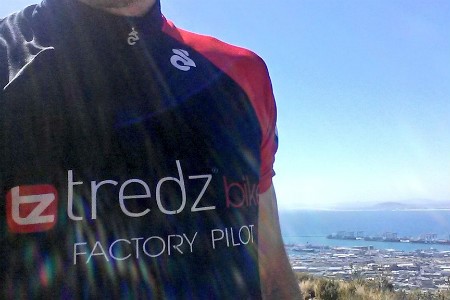 Close up shot of the Tredz logo showing on Scotts jersey with a beach scence in the background